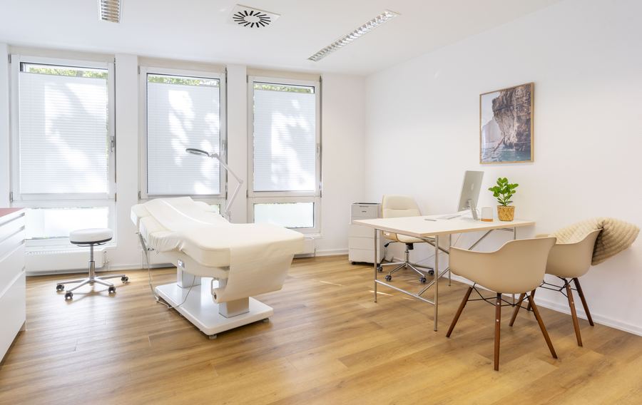 Consultation room with examination couch and consultation desk